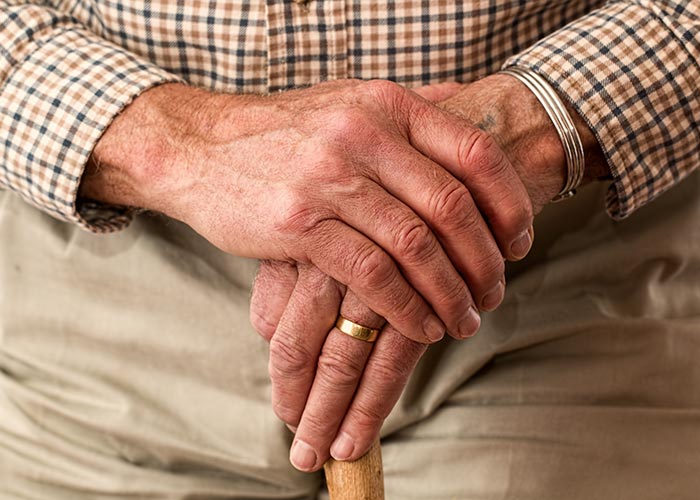 Elderly man's hands. senior living blog header