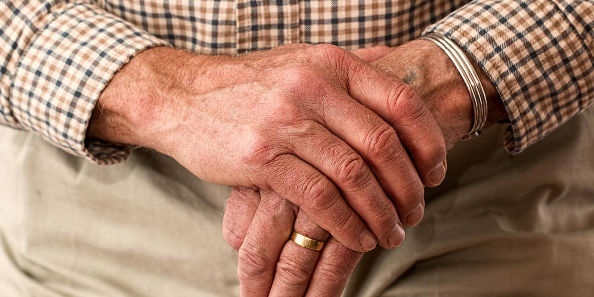 Elderly man's hands. senior living blog header