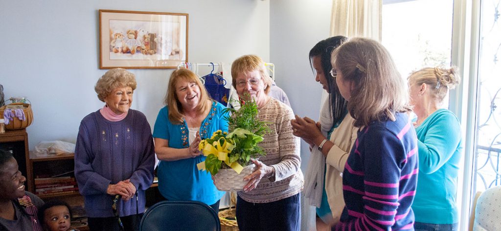 Mary Lizie receives recognition at the 2013 OP Easter Party in Manchester, NH for her service volunteering.