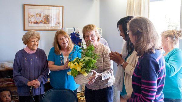 Mary Lizie receives recognition at the 2013 OP Easter Party in Manchester, NH for her service volunteering.