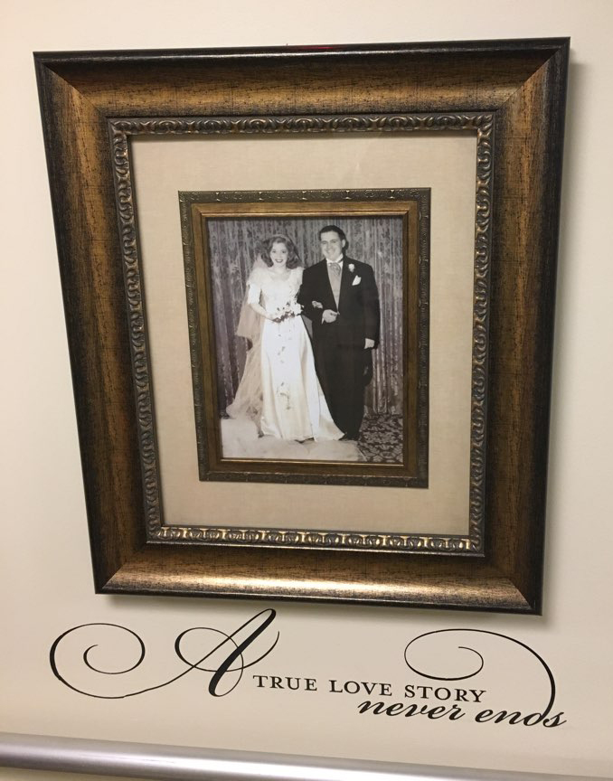 an image of a married couple on the photo wall at the mount carmel rehabilitation and nursing center
