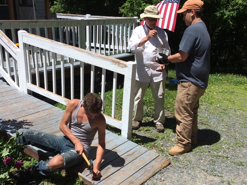 volunteers work on a home during the 2018 hand-in-hand program in the north country.