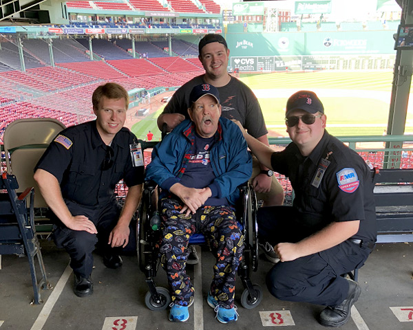 St Teresa Resident Jack with Scott and Tyler, drivers with American Medical Response (AMR) in Manchester, at Fenway Park.