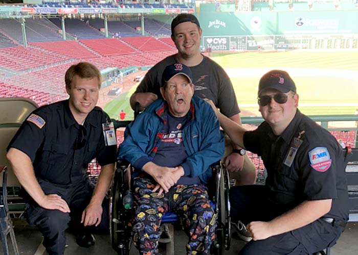 St Teresa Resident Jack with Scott and Tyler, drivers with American Medical Response (AMR) in Manchester, at Fenway Park.