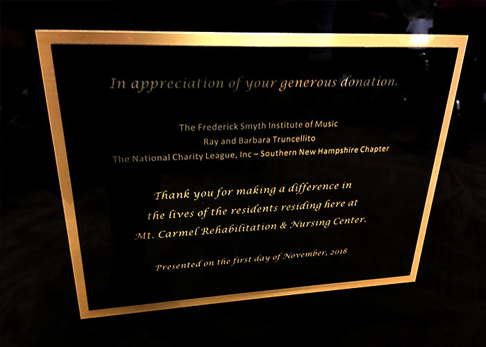 Sign recognizing the donors of the Kawai grand piano at the Mt. Carmel Rehabilitation and Nursing Center.