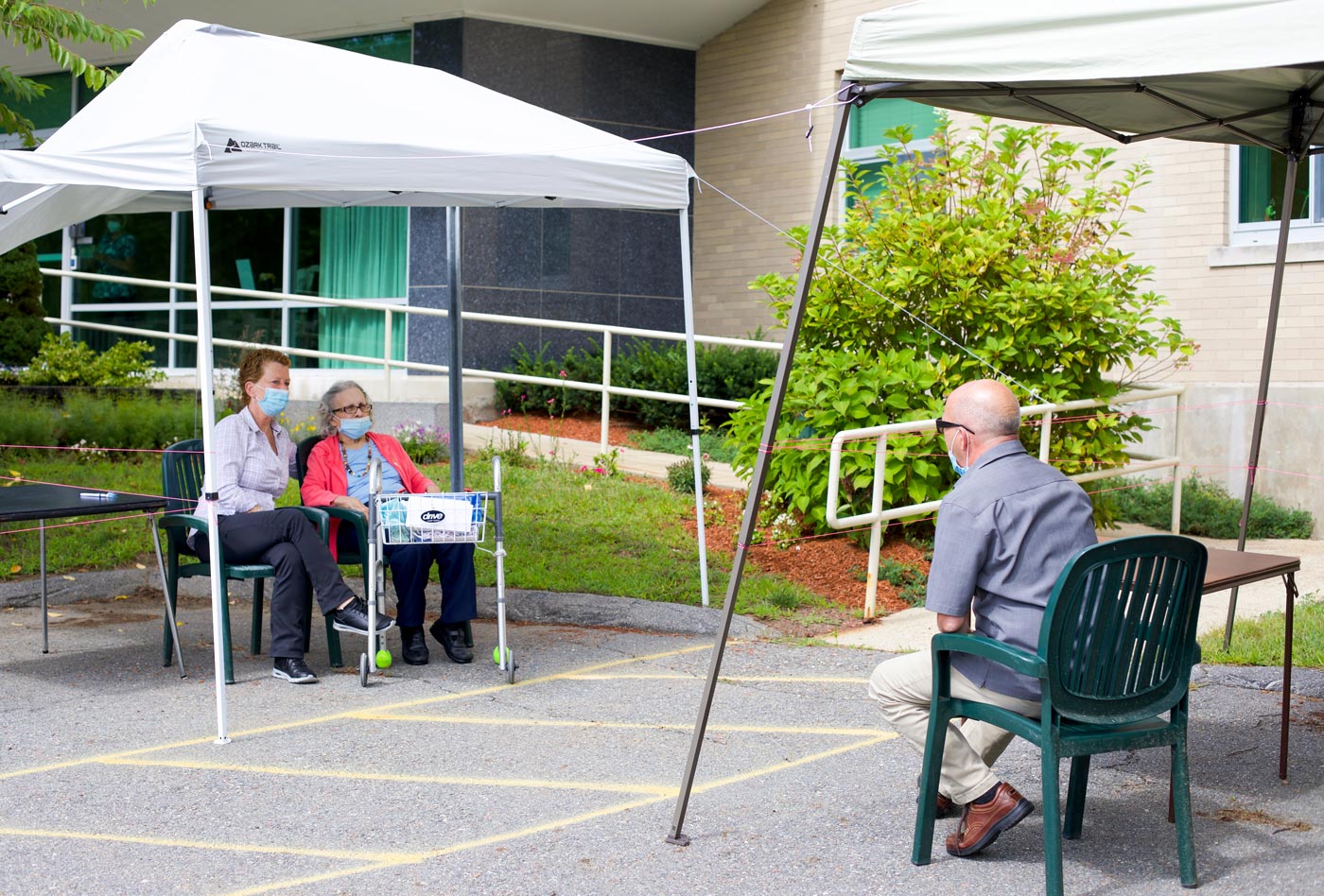 Pam Puzyn and a resident participate in an outdoor visit at the Warde Rehabilitation and Nursing Center in Windham, NH